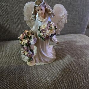 Elegant Angel Figurine with Floral Accents
